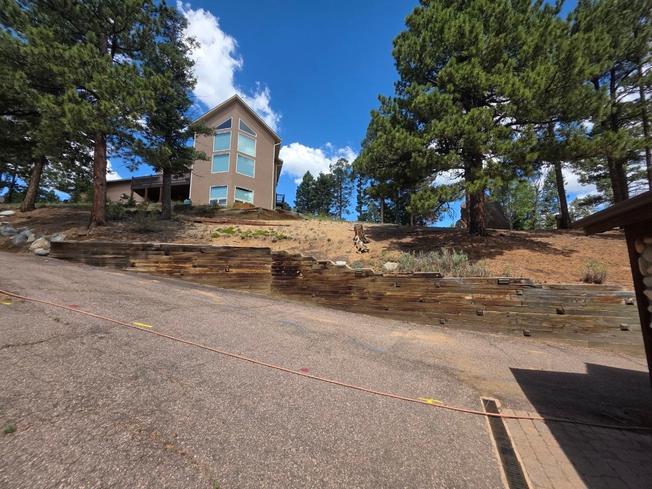 Railroad ties replaced by new boulder retaining wall — Oakden Enterprises